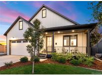 Craftsman style home with white siding, landscaping, and a covered porch at 3260 S Corona St, Englewood, CO 80113