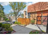 Charming townhome with a private fenced yard and well-maintained landscaping at 6462 E Bates Ave, Denver, CO 80222
