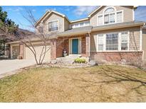Charming two-story home with a well-manicured lawn and a cozy front porch, perfect for relaxing outdoors at 5520 Morgan Way, Frederick, CO 80504