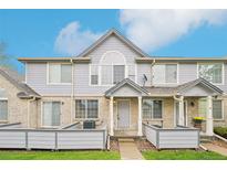 Charming townhouse with a brick and siding exterior, complemented by a well-maintained front lawn at 1259 W 112Th Ave # B, Denver, CO 80234