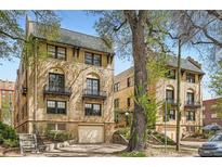 Charming brick apartments with a garage and traditional architectural details including black iron balconies at 960 N Sherman St # 3F, Denver, CO 80203