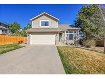 Charming two-story home featuring a two-car garage and well-maintained front yard at 7835 Canvasback Cir, Littleton, CO 80125