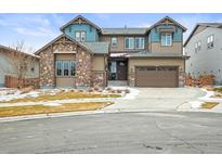 Charming two-story home with a stone accent wall and a two-car garage, perfect for a growing Gathering at 7875 S Grand Baker St, Aurora, CO 80016