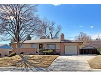 Charming single-Gathering home with a well-maintained front yard and a classic suburban appeal at 12060 W Carolina Dr, Lakewood, CO 80228