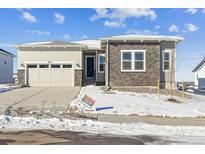 One-story house with a two-car garage and stone accents at 5025 Hickory Oaks St, Castle Rock, CO 80104