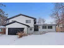 Stunning two-story home with modern exterior and landscaping at 7513 E Bates Dr, Denver, CO 80231