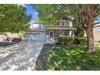 Charming two-story home with stone accents, mature trees, and an attached two car garage at 14625 Vine St, Thornton, CO 80602