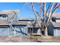 Charming townhome featuring a two-car garage, inviting front porch and beautifully maintained landscaping at 10634 Park Mtn, Littleton, CO 80127