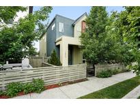 Stylish two-story home with a modern design, xeriscaped front yard, and inviting entry at 1376 Snowberry Ln, Louisville, CO 80027