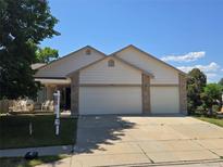 Charming single-Gathering home with a two-car garage, a front porch, and a well-maintained lawn at 5860 W 115Th Ave, Westminster, CO 80020