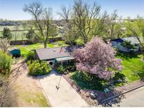Charming ranch style home with mature trees and a well maintained lawn at 1542 Kilkenny St, Boulder, CO 80303