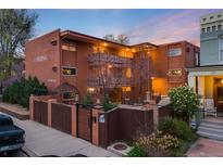 Beautiful multi-Gathering building featuring a gated entrance and well-maintained landscaping at 20 S Logan St # 104, Denver, CO 80209