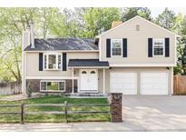 Charming two-story home with a manicured lawn, double-door entry, and a two-car garage at 10422 Nelson Ct, Broomfield, CO 80021