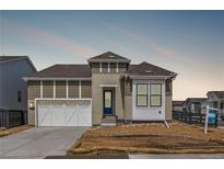 Charming single-Gathering home boasts craftsman details, a 2-car garage, and inviting curb appeal at 9688 Winterset Cir, Littleton, CO 80125
