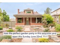 Charming brick home with a beautifully landscaped front yard at 2845 Quitman St, Denver, CO 80212