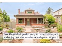 Charming two-story brick home featuring a generous porch and landscaped front yard at 2845 Quitman St, Denver, CO 80212