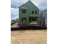 Exterior view of a new two-story home under construction, featuring modern design and sturdy framework in a residential area at 14228 Currant St, Broomfield, CO 80020