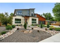 Charming two-story home with modern architecture and xeriscaped front yard at 2635 Pierce St, Wheat Ridge, CO 80214