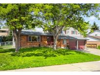 Charming two-story brick home with mature trees and a well-maintained lawn at 9325 Meade St, Westminster, CO 80031