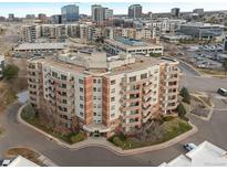 Stunning multi-story condo building with multiple balconies overlooking the cityscape at 4875 S Monaco St # 408, Denver, CO 80237