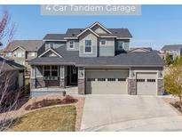 Charming two-story home with a four-car garage and covered front porch at 12659 Stone Creek Ct, Firestone, CO 80504