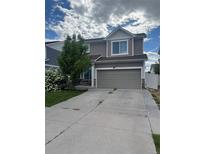 Two-story home featuring neutral siding, stone accents, and an attached two-car garage at 5537 Malta St, Denver, CO 80249