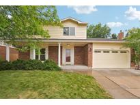 Charming two-story home with brick facade, manicured lawn and a two car garage at 5882 W 109Th Ave, Westminster, CO 80020