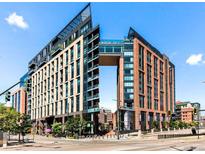 Striking building exterior featuring modern architecture, sleek lines, and ample glass, offering a vibrant urban lifestyle at 1901 Wazee St # 419, Denver, CO 80202
