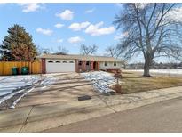 Charming single-story home with a two-car garage and well-maintained front yard at 7746 S Gray St, Littleton, CO 80128