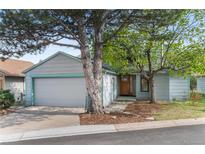 Charming home featuring a two-car garage, mature trees, and lovely landscaping for a welcoming curb appeal at 3620 Silver Plume Ln, Boulder, CO 80305