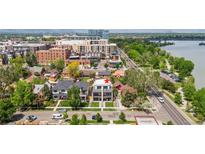 Modern townhome with a lawn, located near shops and a park with lake access at 1647 N Osceola St, Denver, CO 80204