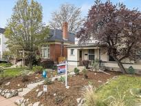 Charming home with a well-manicured front yard, lush landscaping, and inviting curb appeal, new to the market at 3953 Tejon St, Denver, CO 80211