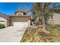 Charming home with a two-car garage, brick accents and well-maintained landscaping at 8270 S High Ct, Centennial, CO 80122