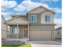 Charming two-story home with a covered front porch and neutral-colored exterior at 6506 13Th St, Frederick, CO 80530