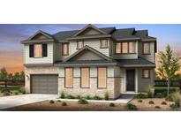 Charming two-story home features a neutral color palette, stone accents, attached two car garage, and landscaped yard at 3370 Backdrop Ct, Castle Rock, CO 80108