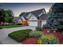 Charming two-story home featuring a three-car garage and well-manicured front yard at 20829 Parliament Ct, Parker, CO 80138