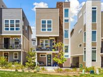Charming two-story home boasts a modern design with lovely landscaping and a welcoming front porch at 2578 Palau Way, Castle Rock, CO 80109
