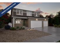 Two-story under construction home with a three-car garage and neutral color scheme at 3848 N Riviera Ct, Aurora, CO 80019