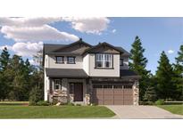 Two-story house with brown accents and a two-car garage at 11053 Snowdon St, Parker, CO 80134