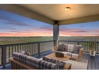 Peaceful deck with scenic views and comfortable seating area at 45425 Wolf Creek Dr, Bennett, CO 80102