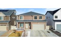 Charming two-story home with a two-car garage and welcoming front porch at 5318 Truckee St, Denver, CO 80249