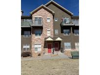 Attractive condo featuring stone accents, dual entry doors, and balcony access at 18726 E Yale Cir # D, Aurora, CO 80013