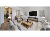 Bright and modern living room featuring stylish furnishings and contemporary decor at 16251 E 17Th Pl # C, Aurora, CO 80011