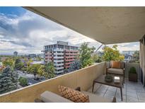 Inviting balcony featuring comfortable seating and a scenic city view at 740 N Pearl St # 503, Denver, CO 80203