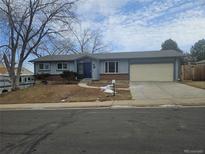 Ranch style home with attached garage and landscaped yard at 8954 N Carr Cir, Broomfield, CO 80021