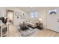Cozy living room with neutral tones, stylish decor, and ample natural light at 8985 Lander St, Westminster, CO 80031