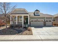 Charming single-Gathering home featuring a covered porch, well-kept landscaping, and a three-car garage at 7968 E 152Nd Dr, Thornton, CO 80602