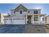 Charming two-story home with a three-car garage and covered front porch at 39856 Floyd St, Elizabeth, CO 80107