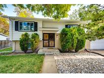 Attractive ranch home with landscaped yard and updated entryway at 6142 Van Gordon St, Arvada, CO 80004