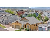 Aerial view of a single-Gathering home in a suburban neighborhood at 3995 Manorbrier Cir, Castle Rock, CO 80104